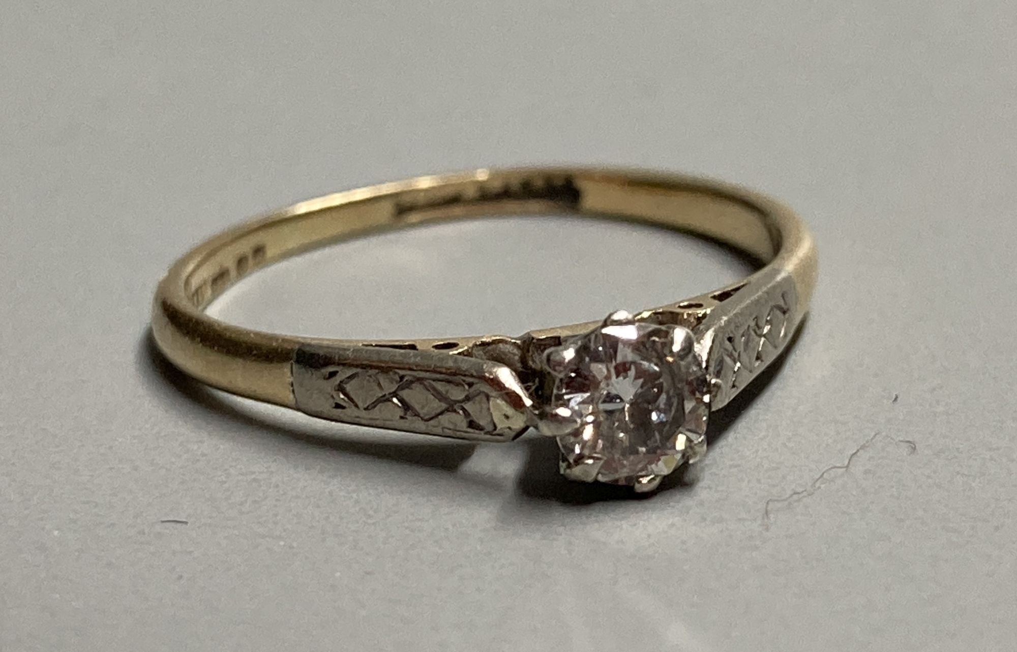 An 14ct gold and solitaire diamond ring, size L, gross 1.8 grams.